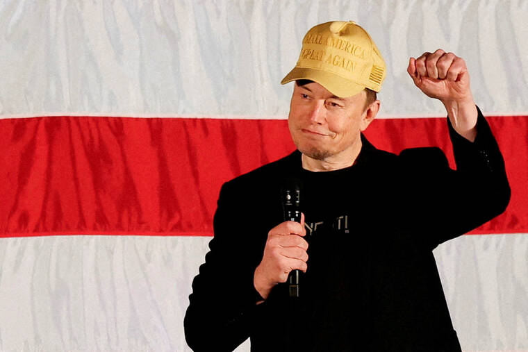 REUTERS/RACHEL WISNIEWSKI/FILE PHOTO
Tesla CEO and X owner Elon Musk, who supports Republican presidential nominee Donald Trump, gestures as he speaks about voting during an America PAC Town Hall in Folsom, Penn., on Oct. 17. Billionaire Elon Musk, set to join President-elect Donald Trumps administration as an outside adviser, waded into Germanys election campaign today, calling the far-right Alternative for Germany (AfD) the countrys savior.