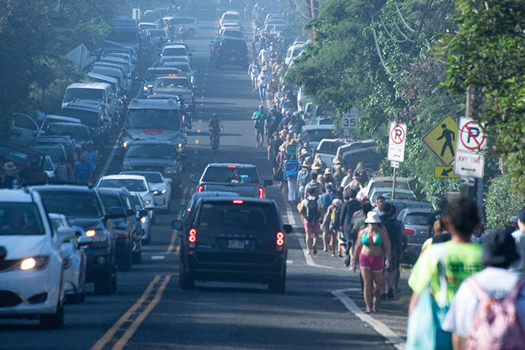 STAR-ADVERTISER / JAN. 22
Kamehameha Highway was congested as crowds flocked to Waimea Bay for The Eddie Aikau Big Wave Invitational in 2023.