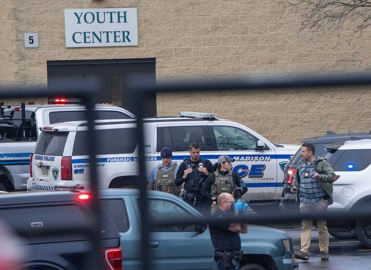 USA TODAY NETWORK
Law enforcement officers are shown at the scene of a shooting at the Abundant Life Christian School in Madison where at least six were injured in addition to the 3 dead.